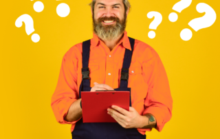 A smiling bearded man in a bright orange shirt and black dungarees is holding a clipboard. There are question marks around him. Is he a roofing consultant or a salesperson?